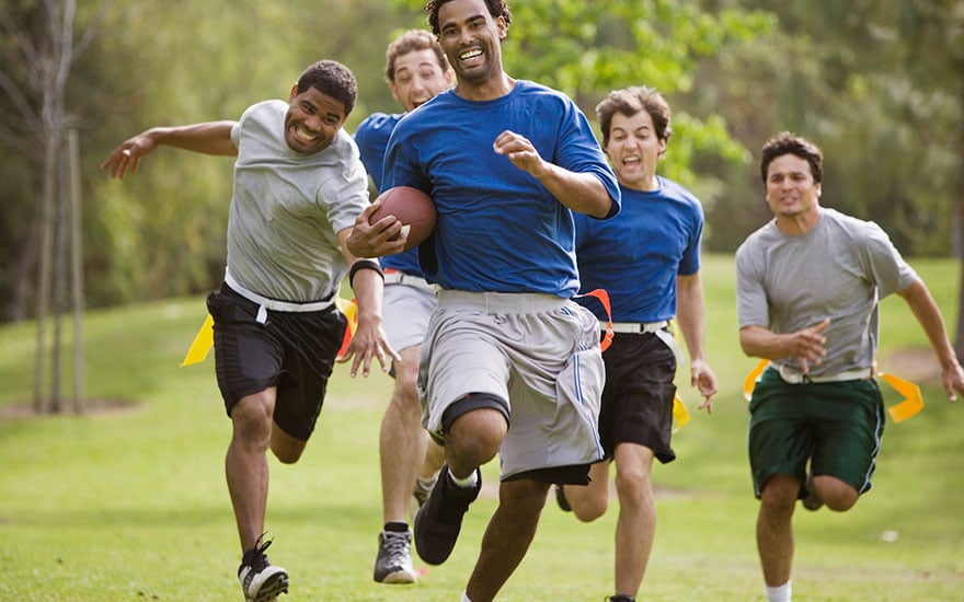 Men playing flag football