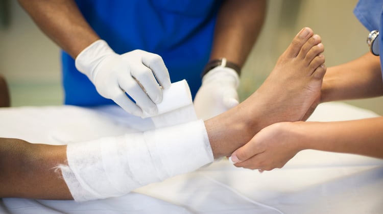Wound Care A physical therapist dresses a patient's wound.